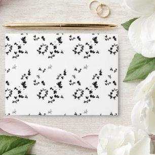 black and white photo of leaves on a white backgro envelope