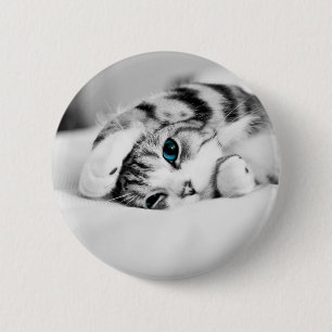 Black and white photograph of a cat button
