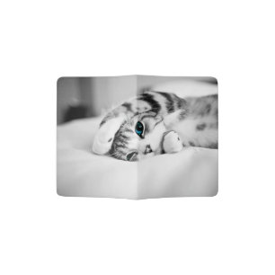 Black and white photograph of a cat passport holder