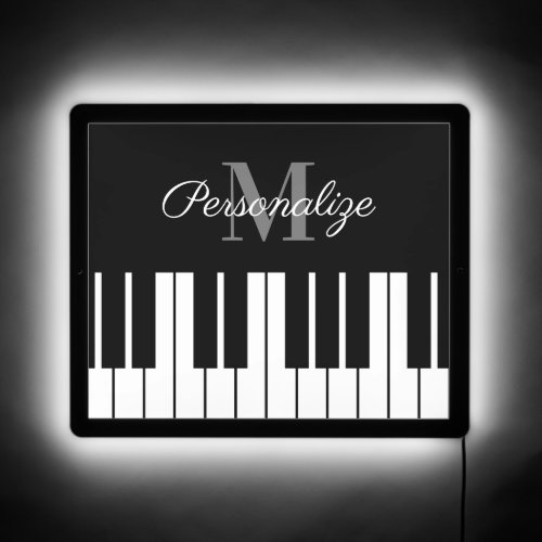 Black and white piano bar LED sign with monogram