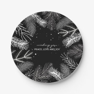Black and white pine tree leaves with snow paper plates