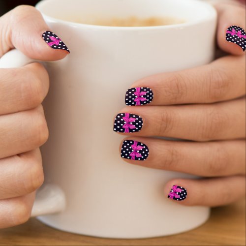 Black and white polka dots with a hot pink bow minx nail art