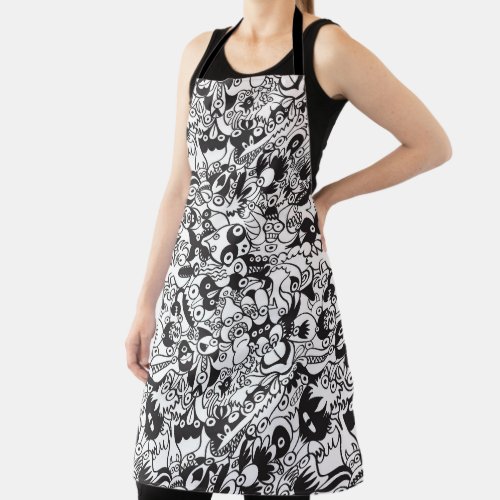 Black and white scary monsters in doodle art style apron