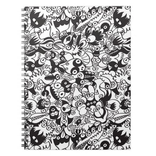 Black and white scary monsters in doodle art style notebook