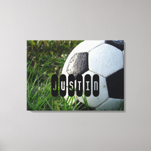 Black and White Soccer Ball in Green Grass Canvas Print