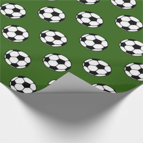Black and White Soccer Balls on Green Wrapping Paper