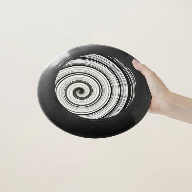 Black and white spiral Wham-O frisbee (In Hand)