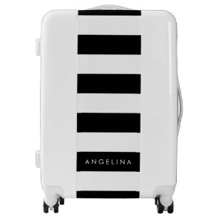 white and black luggage