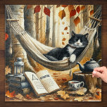 Black and White Tuxedo Cat Dreaming of Adventure Jigsaw Puzzle<br><div class="desc">This cool animal graphic shows a black and white tuxedo cat sleeping in a hammock and dreaming of adventure. Next to this adorable kitty is an open book and in the background there are autumn forest trees.

Makes a great birthday,  Christmas,  or other holiday gift for kitty lovers!</div>