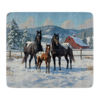 Black Appaloosa Horses on a Farm in Winter Cutting Board
