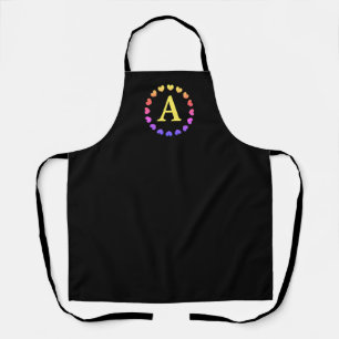 Black apron with rainbow color hearts and monogram
