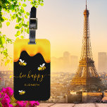 Black bee happy bumble bees sweet honey monogram luggage tag<br><div class="desc">A chic black background decorated with golden dripping honey. The text: Bee Happy with a golden hand lettered style script with swashes.  Personalize and add your name.</div>