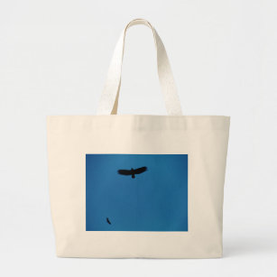 Black bird in a Blue Sky Large Tote Bag