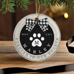 Black Bow Paw Print Memorial Pet Photo Wood Slice Ceramic Ornament<br><div class="desc">Rustic pet memorial photo ornament featuring a rustic faux birch wood slice background decorated with a buffalo black and white plaid bow and white paw print. Customize with your pet's name , year born, year passed and monogram. The reverse side features a place to add your pet's photo. Designed by...</div>