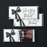 Black Bow She's Tying the Knot Bridal Shower Hershey Bar Favors<br><div class="desc">Make your favors unforgettable with these Black Bow "She’s Tying the Knot" bridal shower Hershey Bar wrappers 🎀 Featuring a timeless black ribbon design and elegant text, they add a chic touch to any table setting or favor display. Slide them over standard-sized chocolate bars for a sweet and stylish treat...</div>