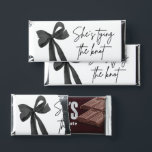 Black Bow She's Tying the Knot Bridal Shower Hershey Bar Favors<br><div class="desc">Make your favors unforgettable with these Black Bow "She’s Tying the Knot" bridal shower Hershey Bar wrappers 🎀 Featuring a timeless black ribbon design and elegant text, they add a chic touch to any table setting or favor display. Slide them over standard-sized chocolate bars for a sweet and stylish treat...</div>