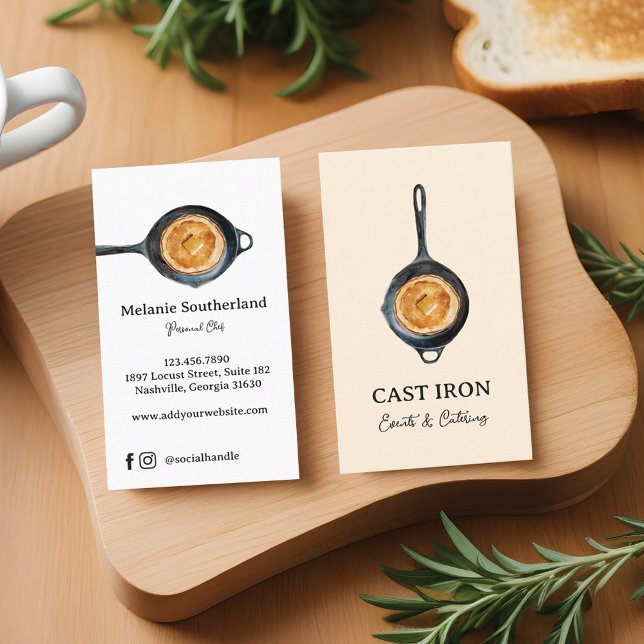 Black Cast Iron Skillet Personal Chef & Catering Business Card (closeup of two blank white vertical business card resting on a wooden butcher block countertop along)