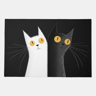 Black Cat and White Cats on Black Doormat