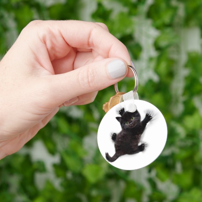 Black Cat Climbing On Human Back Keychain (Hand)