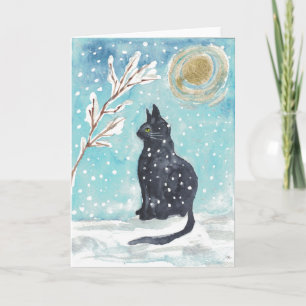 Black cat in the snow - holiday card