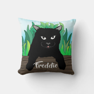 Black cat on fence with green grass, solid back throw pillow
