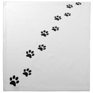 Black cat paw prints on white cloth napkin
