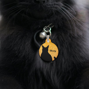 Black cat silhouette on a festive orange glitter pet ID tag