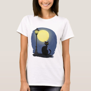 Black Cat Sitting Calmly Under a Glowing T-Shirt