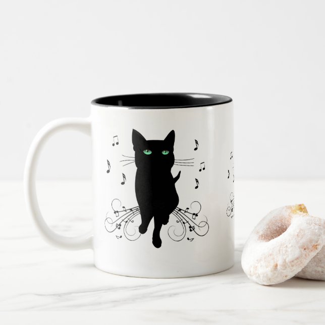 Black Cat Surrounded by Whispering Notes of Music Two-Tone Coffee Mug (With Donut)