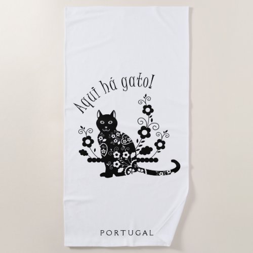 Black cat with flowers and Portuguese expression Beach Towel