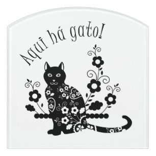 Black cat with flowers and Portuguese expression Door Sign