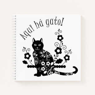 Black cat with flowers and Portuguese expression Notebook