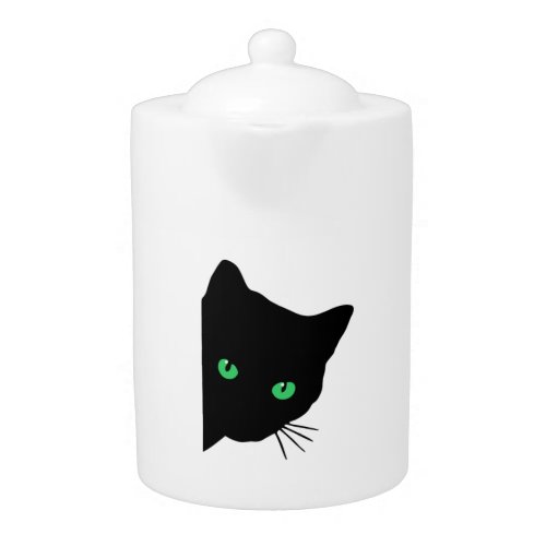 black cat with green eyes   teapot