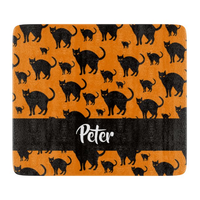 Black cats on orange cutting board (Front)