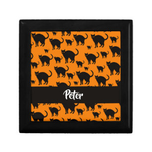 Black cats on orange gift box