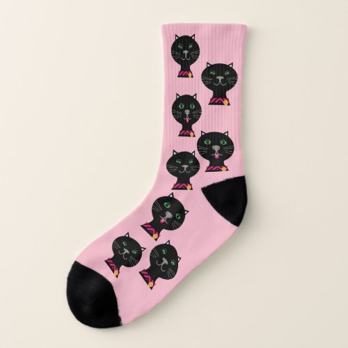 Black cats smile and poke tongues out on pink socks