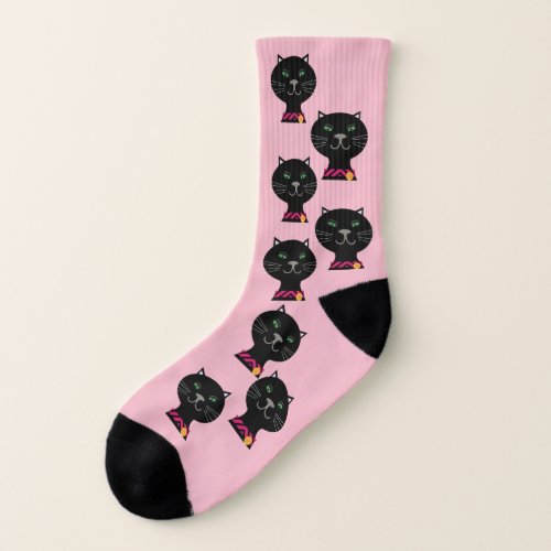 Black cats with green eyes on pink socks