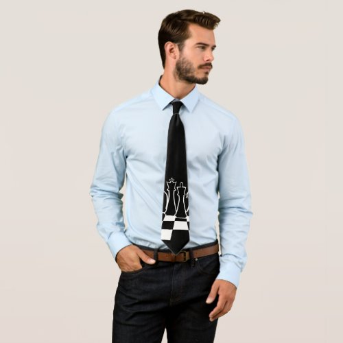 Black chess pieces on a chessboard neck tie