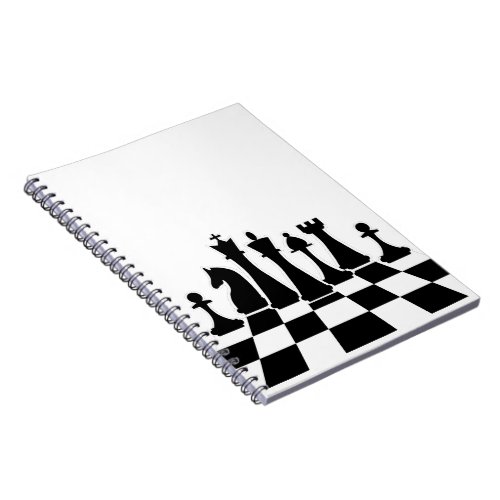 Black chess pieces on a chessboard notebook