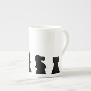 Black chess pieces on white bone china mug