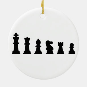 Black chess pieces on white ceramic ornament