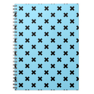 Black cross stitches on baby blue notebook