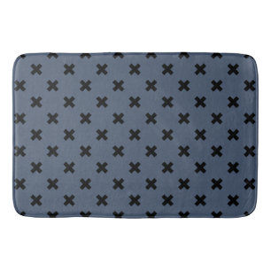 Black cross stitches on blue-gray bath mat