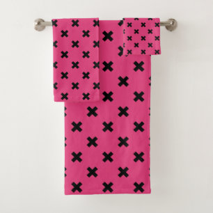Black cross stitches on fuchsia bath towel set