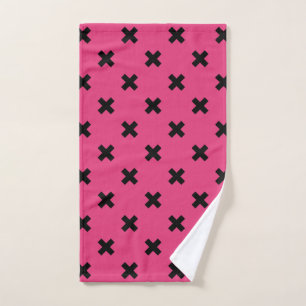 Black cross stitches on fuchsia hand towel