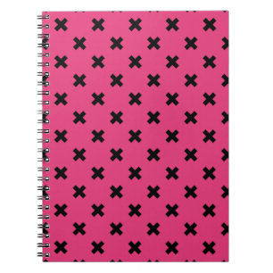Black cross stitches on fuchsia notebook