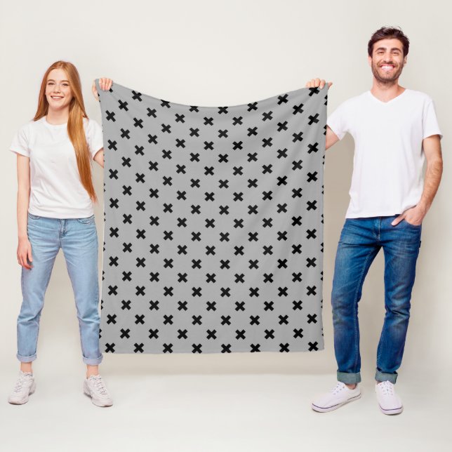 Black cross stitches on gray fleece blanket (In Situ)