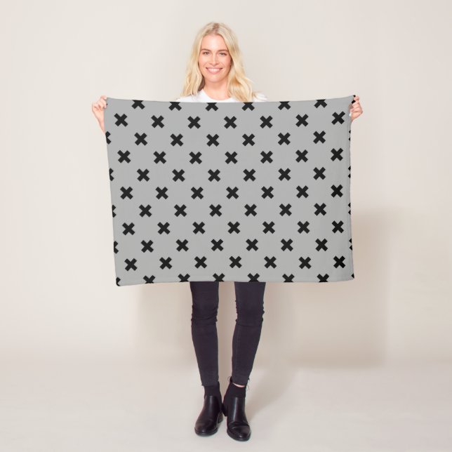 Black cross stitches on gray fleece blanket (In Situ)