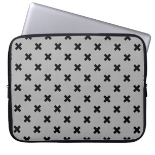 Black cross stitches on grey laptop sleeve
