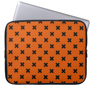 Black cross stitches on orange laptop sleeve